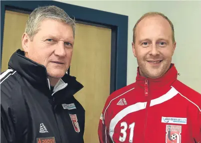  ??  ?? TITLE TRACK: Locos manager Neil Cooper is delighted with the form of Stuart Duff, right, and his team-mates