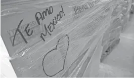  ?? PATRICK BREEN/THE REPUBLIC ?? Written on the side of a package of supplies shipped to Mexico to help victims of the recent earthquake­s is the message “Te amo Mexico,” or “I love you Mexico.”