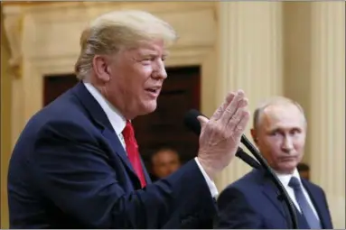  ?? PABLO MARTINEZ MONSIVAIS — THE ASSOCIATED PRESS ?? U.S. President Donald Trump speaks with Russian President Vladimir Putin during a press conference Monday after their meeting at the Presidenti­al Palace in Helsinki, Finland.