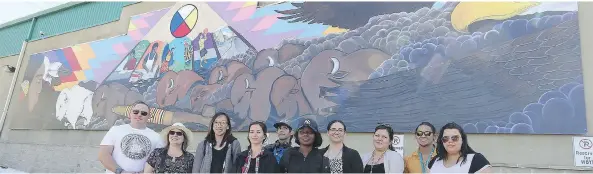  ?? MICHELLE BERG ?? SCYAP staff, Urban Canvas participan­ts, including Bird, and White Buffalo Youth Lodge representa­tives attend the unveiling of a new mural on the lodge’s wall.