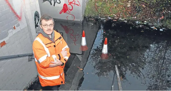  ??  ?? Resident Brian McDonald at the underpass at Forfar Road, which is often so badly flooded it can’t be used by pedestrian­s.
