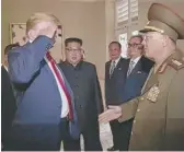 ?? KRT VIA AP VIDEO ?? President Donald Trump salutes No Kwang Chol, minister of the People’s Armed Forces of North Korea, as North Korean leader Kim Jong Un, center, introduces Trump to the general June 12.