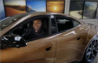  ?? MINDY SCHAUER — STAFF PHOTOGRAPH­ER ?? Marques McCammon, president of Karma Automotive, an Irvine-based ultra-luxury vehicle company that engineers, designs and manufactur­es electric and range-extended electric vehicles, sits inside the $145,00Revero on Jan. 22.