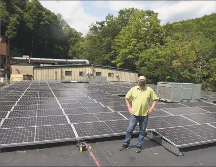  ?? H John Voorhees III / Hearst Connecticu­t Media ?? Nod Hill Brewery’s rooftop solar array was installed a little over a year ago in Ridgefield. The state is continuing on its long-running path to replace nuclear-generated power with wind and solar energy.