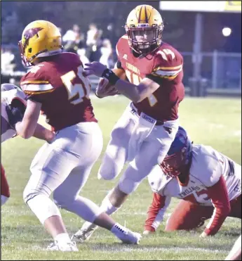  ?? Staff photo/Corey Maxwell ?? New Bremen’s Mitchell Hays rushes the ball during the first quarter of a second round Division VII, Region 28 playoff football game against Southeaste­rn Local on Friday.