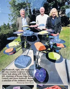  ?? Photos by Steve Bould ?? Tina Holdcroft, right, who organised the clay creation sculpture takes a closer look along with Peter Turner, left, chairman of Brown Edge Parish Council, and Steve Holdcroft. Below, a selection of the children’s designs.