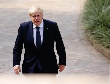  ?? (Dan Kitwood/Pool Photo via AP) ?? Britain’s Prime Minister Boris Johnson arrives for the Leaders’ Retreat on the sidelines of the Commonweal­th Heads of Government Meeting at Intare Conference Arena in Kigali, Rwanda, Saturday, June 25, 2022.