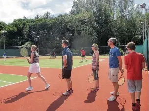  ??  ?? ●● Visitors line up at the free tennis taster day at Prestbury Tennis Club