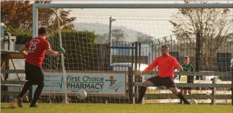  ??  ?? Rathnew goalkeeper Johnny Byrne fires past Niall Vaughan with his penalty during the shoot-out in the Wicklow Cup final.