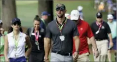  ?? CHRIS O’MEARA — THE ASSOCIATED PRESS ?? Swimmer Michael Phelps walks the back nine during the first round of the PGA Championsh­ip at the Quail Hollow Club Thursday in Charlotte, N.C.