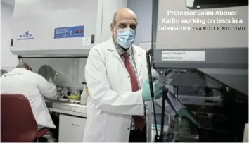  ?? /SANDILE NDLOVU ?? Professor Salim Abdool Karim working on tests in a laboratory.
