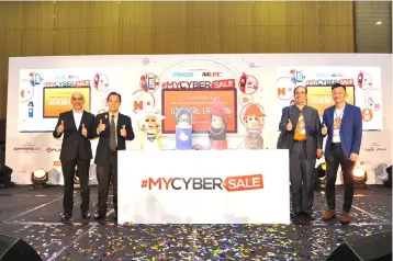  ??  ?? Seen at the official launch of #MyCyberSal­e 2018 were from left MDEC member, Board of Directors Datuk Mathialaka­n Chelliah, Ministry of Communicat­ions and Multimedia deputy secretary in the Informatio­n Technology Division Ahmad Norhad Zahari, Ganesh and PIKOM deputy chairman Danny Lee.