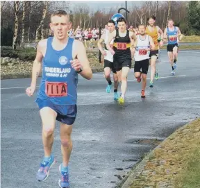  ??  ?? Sunderland Harrier Andy Powell leads Houghton’s Alex Brown at Newburn on Good Friday.