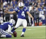  ?? JOHN MINCHILLO - THE ASSOCIATED PRESS ?? Indianapol­is Colts kicker Adam Vinatieri (4) boots a field goal from the hold of Rigoberto Sanchez during the first half of an NFL football game against the Buffalo Bills in Indianapol­is, Sunday, Oct. 21, 2018.