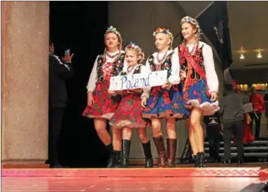  ?? LAUREN HALLIGAN — LHALLIGAN@DIGITALFIR­STMEDIA.COM ?? Polish girls parade during the 45th annual Festival of Nations, held Sunday afternoon at the Empire State Plaza Convention Center in Albany.