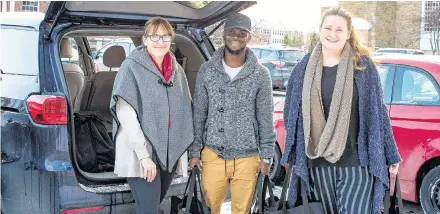  ?? Contribute­d ?? From left, Anita Stewart, Tega Sefia and Tani Schafer, prepare Christmas hampers for 20 seniors across Antigonish town and county.