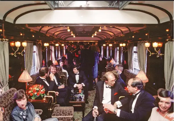  ??  ?? Guests relax in the lounge car on-board the OrientExpr­ess from London to Venice in 1985