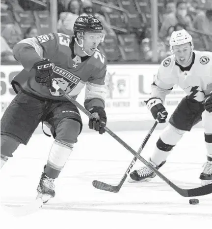  ?? LYNNE SLADKY/AP ?? Panthers forward Carter Verhaeghe (23) skates with the puck during the second period Monday against the Lightning in Sunrise.