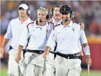  ?? KIRBY LEE/USA TODAY, FILE ?? Coach Pete Carroll, second from left, won two national titles at USC in the 2000s and a Super Bowl with the Seattle Seahawks before stepping down in January.