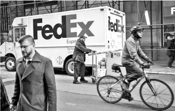  ?? — AFP photo ?? Shares of FedEx stocks dropped more than 10 per cent on Wednesday, adding to a nearly 32 per cent plunge this year.