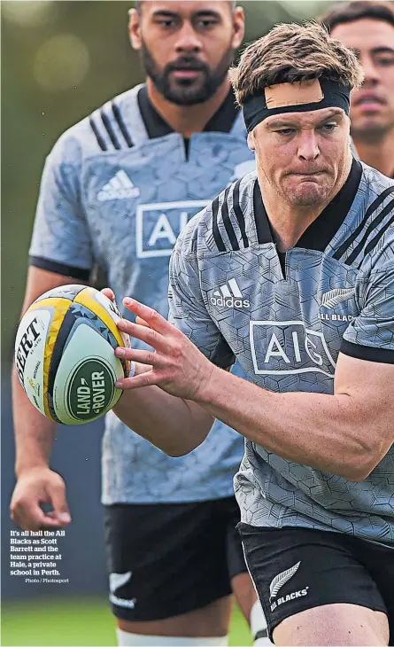  ?? Photo / Photosport ?? It’s all hail the All Blacks as Scott Barrett and the team practice at Hale, a private school in Perth.