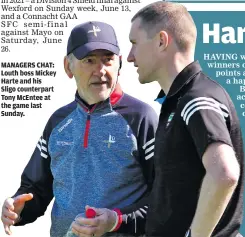  ??  ?? MANAGERS CHAT: Louth boss Mickey Harte and his Sligo counterpar­t Tony McEntee at the game last Sunday.