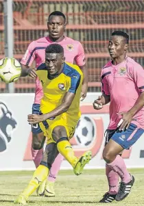  ?? / SYDNEY SESHIBEDI/GALLO IMAGES ?? Denzil Haoseb of Jomo Cosmos takes a shot despite the attention of Black Leopards players during their promotion playoff yesterday.