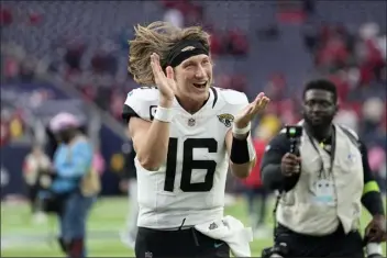  ?? ERIC GAY — THE ASSOCIATED PRESS ?? Jacksonvil­le Jaguars quarterbac­k Trevor Lawrence (16) celebrates as he jogs off the field after the teams NFL football game against the Houston Texans in Houston, Sunday, Nov. 26, 2023.
