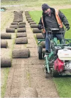  ??  ?? Ivan Luscombe hard at work on the turfcutter.