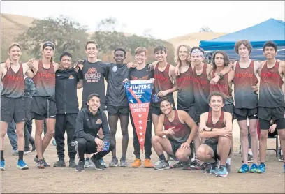  ?? PHOTOS CONTRIBUTE­D ?? The Vacaville High School boys cross country team claimed the Monticello Empire League crown in dominating fashion.