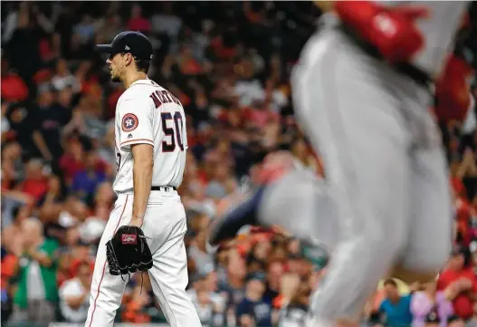  ?? Karen Warren / Houston Chronicle ?? Charlie Morton (50) has no interest in watching Andrew Benintendi head for the plate after hitting a fifth-inning home run that put the Red Sox up 3-0.