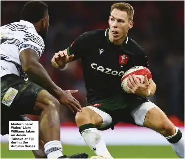  ?? ?? Modern hero: Wales’ Liam Williams takes on Josua Tuisova of Fiji during the Autumn Series