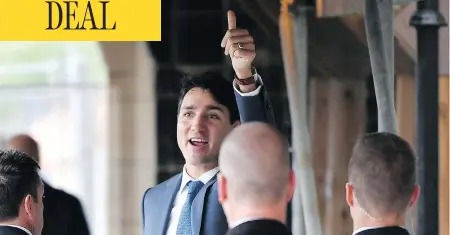  ?? JUSTIN TANG/THE CANADIAN PRESS ?? Prime Minister Justin Trudeau gives a thumbs-up as he enters Parliament on Monday, the morning after an agreement was reached on a new trade deal with Mexico and the U.S. after months of tense negotiatio­ns and threats of deadlines by the Trump administra­tion.
