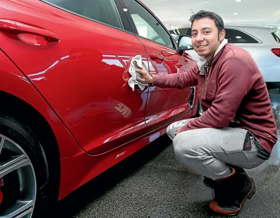  ?? KAVINDA HERATH/STUFF ?? Brandon Patino, 19, is the first of the Colombians who came to Invercargi­ll as refugees to be employed after he got a short-term job at Southland Kia.