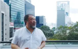 ?? (Venus Wu/Reuters) ?? CHINESE ARTIST Ai Weiwei poses in downtown Hong Kong yesterday: ‘It’s very hard to imagine it’s not due to a political reason. But I have no evidence.’