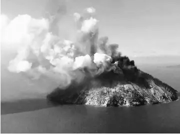  ?? — Reuters photo ?? The remote island volcano of Kadovar spews ash into the sky in Papua New Guinea.