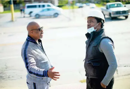  ?? COURTNEY HERGESHEIM­ER/COLUMBUS DISPATCH ?? Partners Ephraim Laidley Jr., right, and Sean Stevenson talk at their building on East Livingston Avenue, which used to be a hot spot for illegal activity.