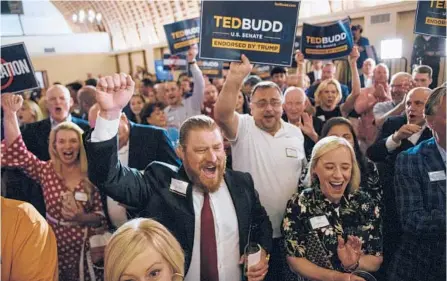  ?? MELISSA SUE GERRITS/GETTY ?? Supporters of Rep. Ted Budd, R-NC, celebrate his Senate GOP nomination at a party Tuesday.