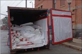  ??  ?? Francine D. Grinnell — Digital First Media Asbestos abatement vehicle can be seen being used to facilitate asbestos removal during the project at the Police Department portion of Saratoga Springs City Hall.