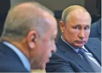  ?? ALEXEI DRUZHININ/SPUTNIK, KREMLIN POOL PHOTO VIA AP ?? Russian President Vladimir Putin, right, listens to Turkish President Recep Tayyip Erdogan during their meeting Tuesday in Sochi, Russia.