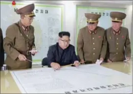  ?? KRT VIA AP VIDEO ?? This image made from video of an still image broadcast in a news bulletin on Tuesday by North Korea’s KRT shows North Korean leader Kim Jong Un receiving a briefing in Pyongyang. North Korea said leader Kim Jong Un was briefed on his military’s plans...