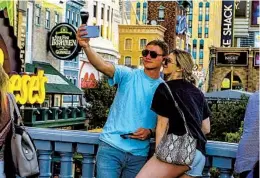  ?? GETTY IMAGES ?? A new law aiming to keep pedestrian flow moving makes it a gamble to stop and snap a selfie on one of Las Vegas Boulevard’s pedestrian overpasses.