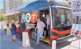  ?? GREG SORBER/JOURNAL ?? Jim Maddox, of Albuquerqu­e, steps off a BYD bus he toured before a press conference announcing the selection of the company’s buses for the Albuquerqu­e Rapid Transit at the Civic Plaza in July 2016.