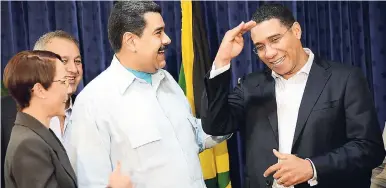  ?? FILE ?? Prime Minister Andrew Holness,(right) tickles the funny bone of Venezuelan President Nicolás Maduro (centre) during a working visit to Jamaica on May 22, 2016. Also in the photo is Senator Kamina Johnson Smith, Jamaica's foreign minister.