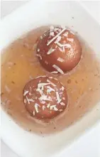  ?? MICHAEL SEARS, MILWAUKEE JOURNAL SENTINEL ?? Royal India's gulab jamun, pastries served in syrup, are especially light.