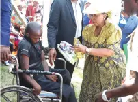  ?? ?? First Lady Dr Auxillia Mnangagwa hands over food hampers to people living with disabiliti­es and the elderly in Hurungwe yesterday.