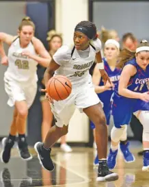  ?? STAFF PHOTO BY ROBIN RUDD ?? Bradley Central’s Rhyne Howard (23) looks to pass on a fast break in Friday’s 83-34 win over Cleveland. Howard had eight assists in addition to 13 points and seven rebounds.