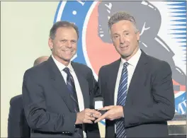  ?? BRUCE BENNETT — GETTY IMAGES ?? Member of the selection committee Mike Gartner, left, presents a Hall of Fame ring to Sharks GM Doug Wilson at the Hockey Hall Of Fame on in Toronto on Nov. 12.