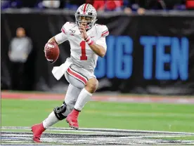  ?? MICHAEL CONROY / AP ?? Ohio State quarterbac­k Justin Fields during last season’s Big Ten championsh­ip game. The Big Ten is going to give fall football a shot after all. Less than fiveweeks after pushing fall sports to spring, the conference changed courseWedn­esday.