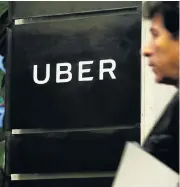  ?? /Reuters ?? More trouble: A man outside Uber offices in New York. The FBI is investigat­ing the company’s use of a spyware program.